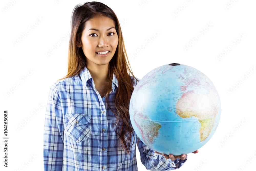 Smiling asian woman holding a globe Smiling asian woman holding a globe