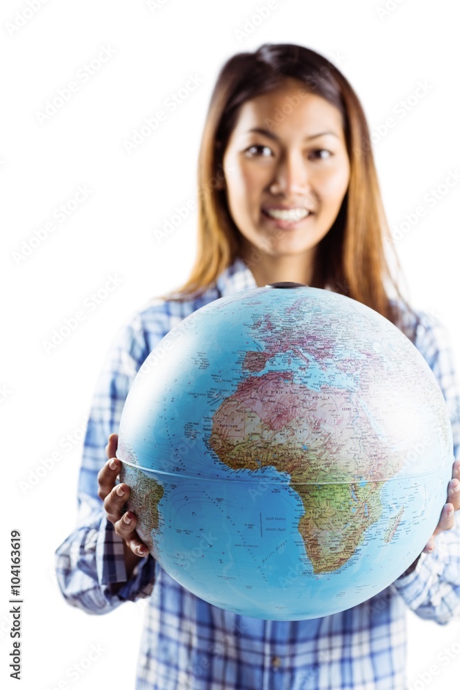 Smiling asian woman holding a globe Smiling asian woman holding a globe