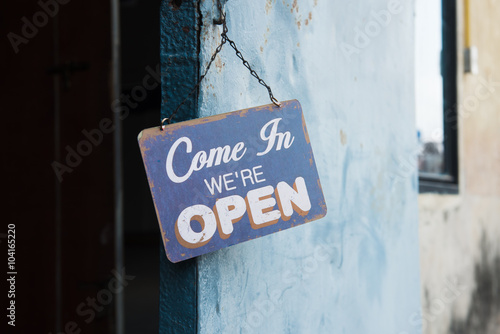 Vintage open sign on metal door