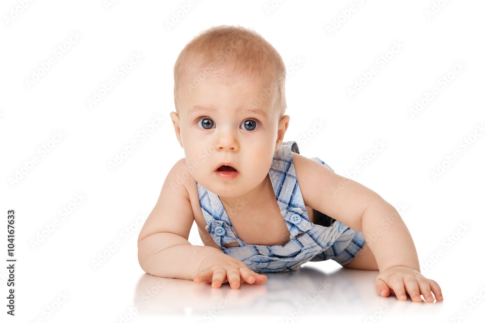 Baby is lying on floor, isolated on white Baby is lying on floor, isolated on white