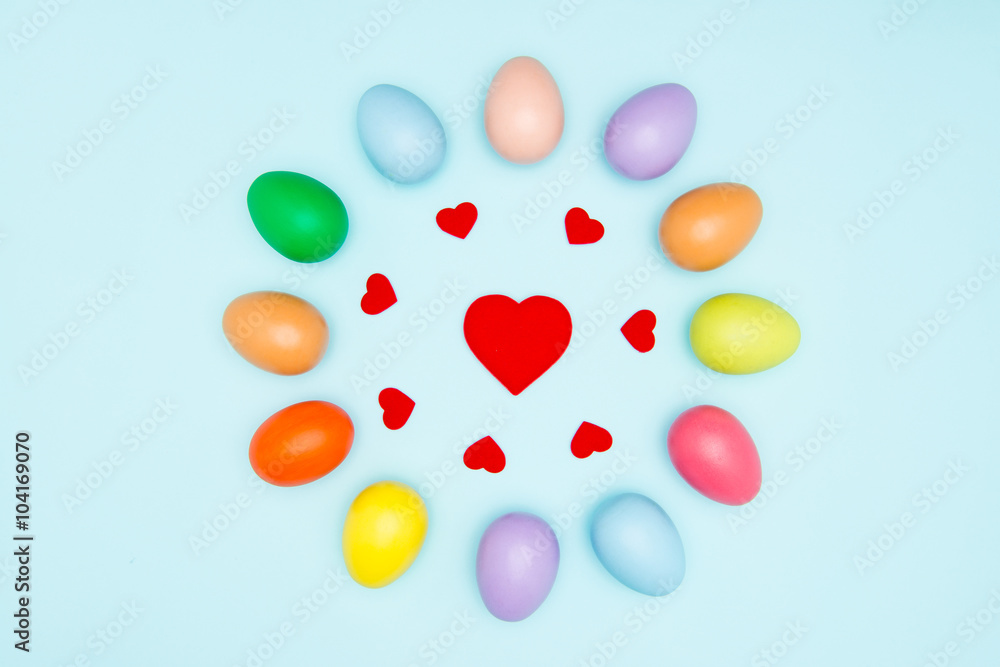 Fototapeta premium Colorful easter eggs on pastel background