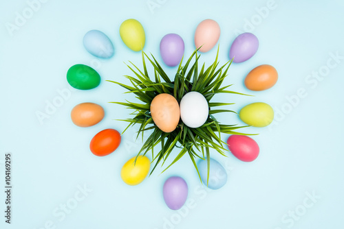 Colorful easter eggs on pastel background