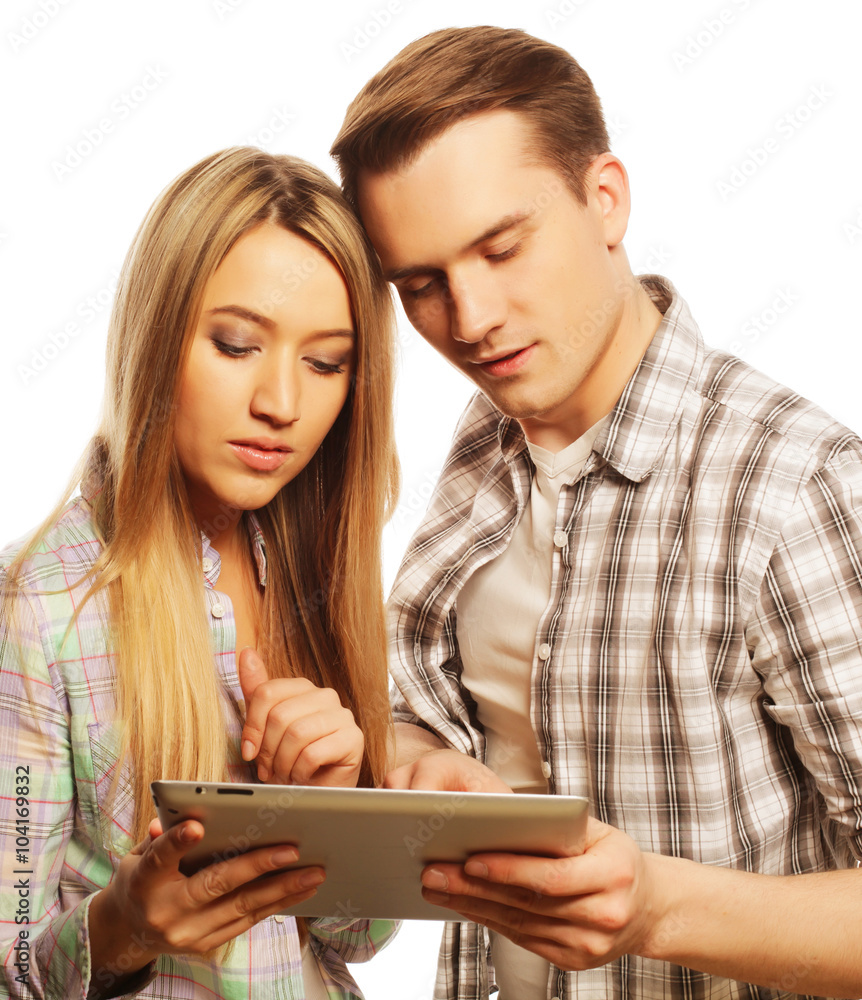 happy young couple holding tablet pc computer happy young couple holding tablet pc computer