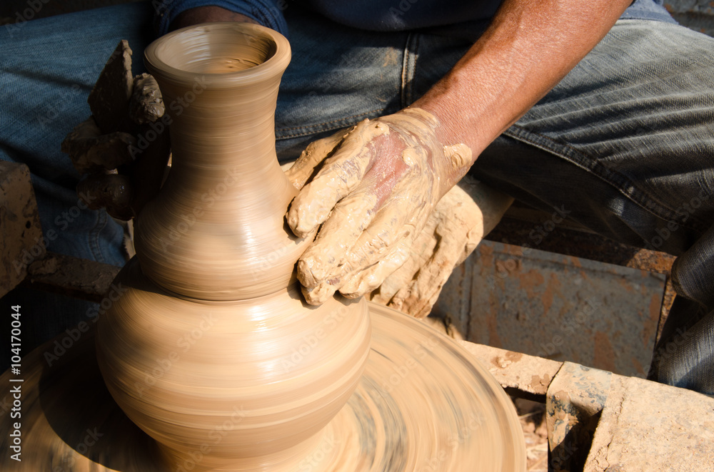 Hands of making clay pot on the pottery wheel ,select focus, close-up. Hands of making clay pot on the pottery wheel ,select focus, close-up.