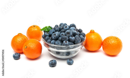 tangerines and blueberries on a white background close-up.