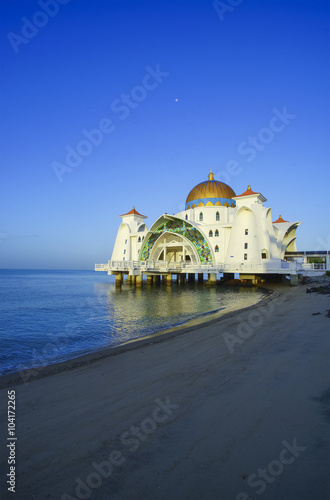 View of beautiful Malacca Straits Mosque during bright blue sky with copyspace area