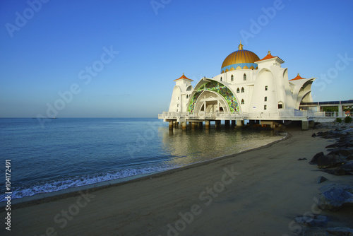View of beautiful Malacca Straits Mosque during bright blue sky with copyspace area