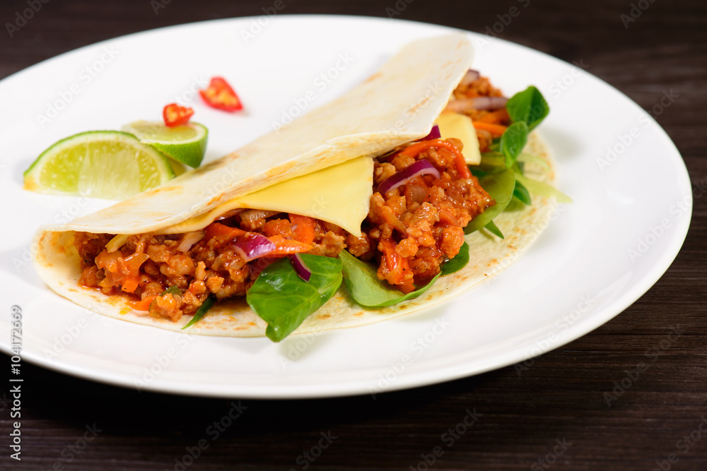 Tacos on a white plate