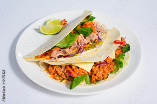 Tacos on a white plate
