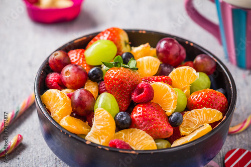 dish full various fresh colorful fruits