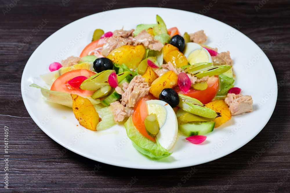 salad with meat,egg, tomatoes, olives and vegetables