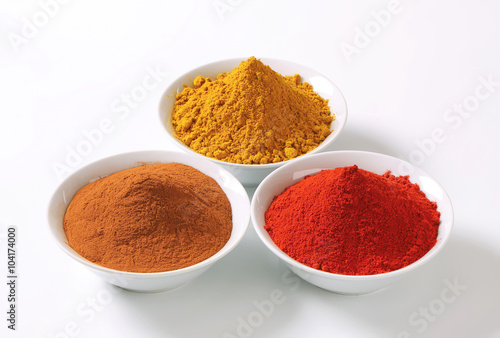 Curry powder, paprika and ground cinnamon