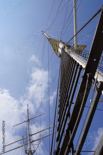 Mainmast of a sailing ship under blue sky