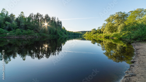 Summer river with reflections