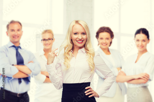 smiling businesswoman or secretary in office