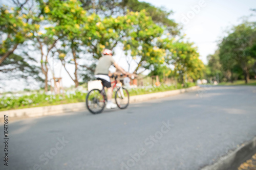 men in bicycle blur background