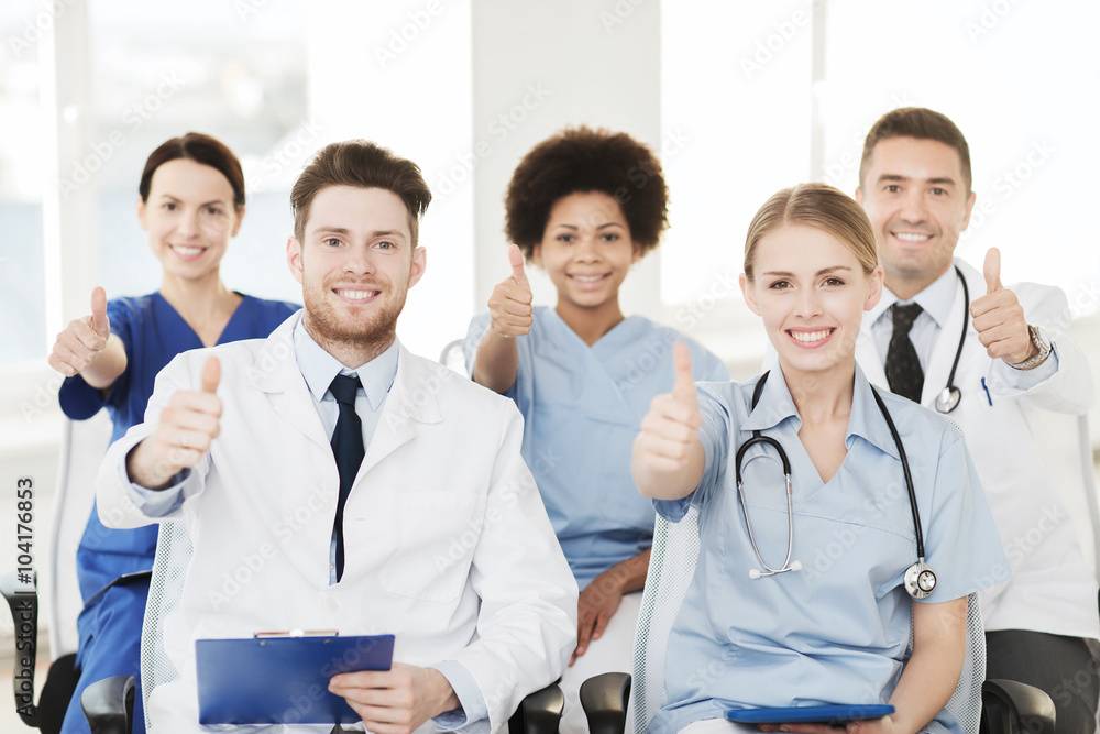 group of happy doctors on seminar at hospital group of happy doctors on seminar at hospital