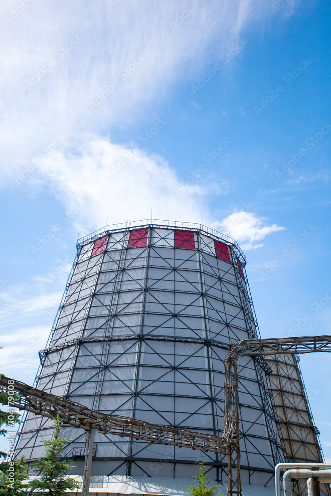 Factory pipe produces smoke in the sky