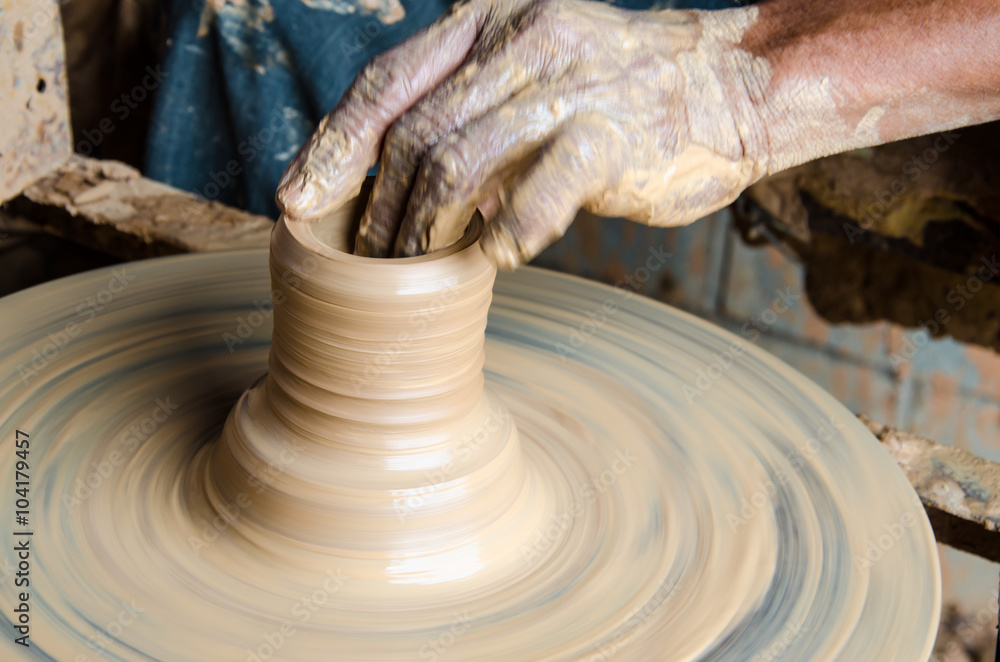 Hands of making clay pot on the pottery wheel ,select focus, close-up. Hands of making clay pot on the pottery wheel ,select focus, close-up.