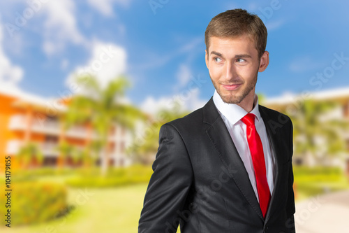 Young Businessman looking over his shoulder