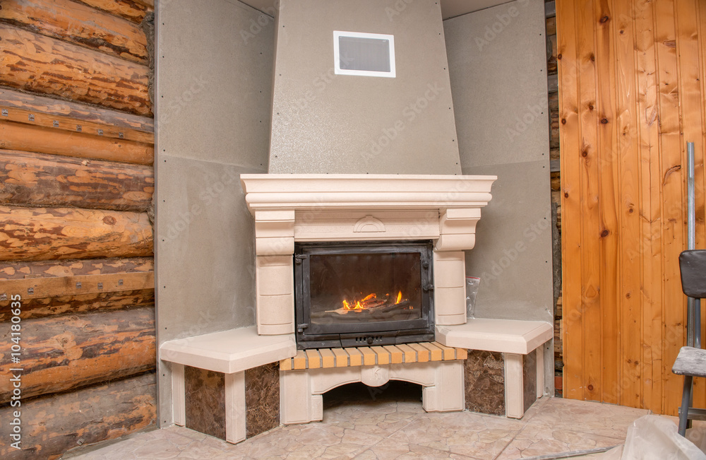 Unfinished fireplace in a wooden house Unfinished fireplace in a wooden house