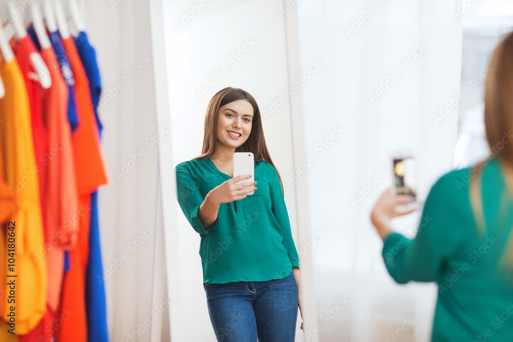 woman with smartphone taking mirror selfie at home woman with smartphone taking mirror selfie at home