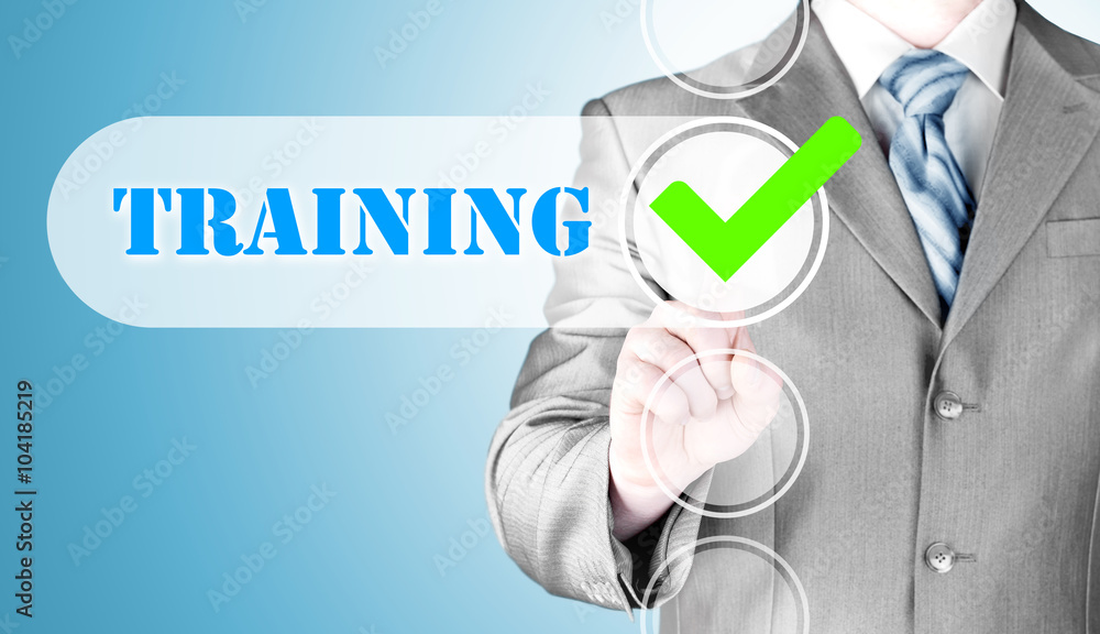 Businessman pressing touch screen interface training checkbox Businessman pressing touch screen interface training checkbox