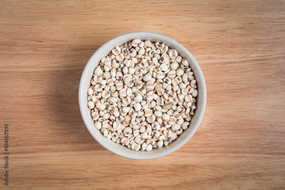 bowl of millet on the wood background