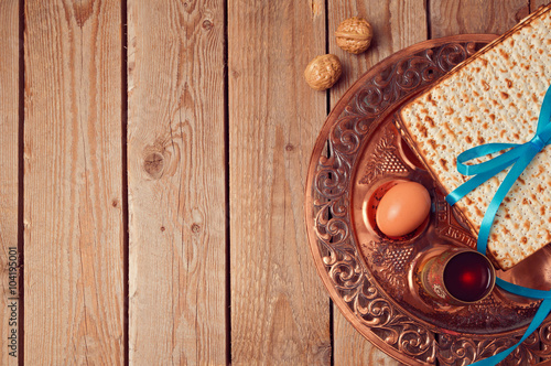 Passover background with matzo and vintage seder plate. View from above