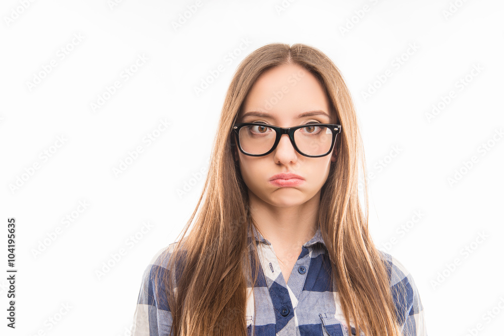 Smart tired girl in glasses posing with inflated cheeks