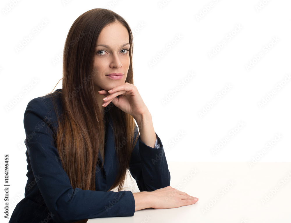 smiling businesswoman sitting at her desk