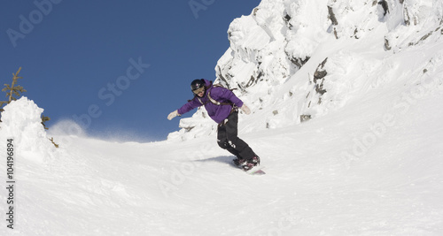 snowboarder on ski resort terrain