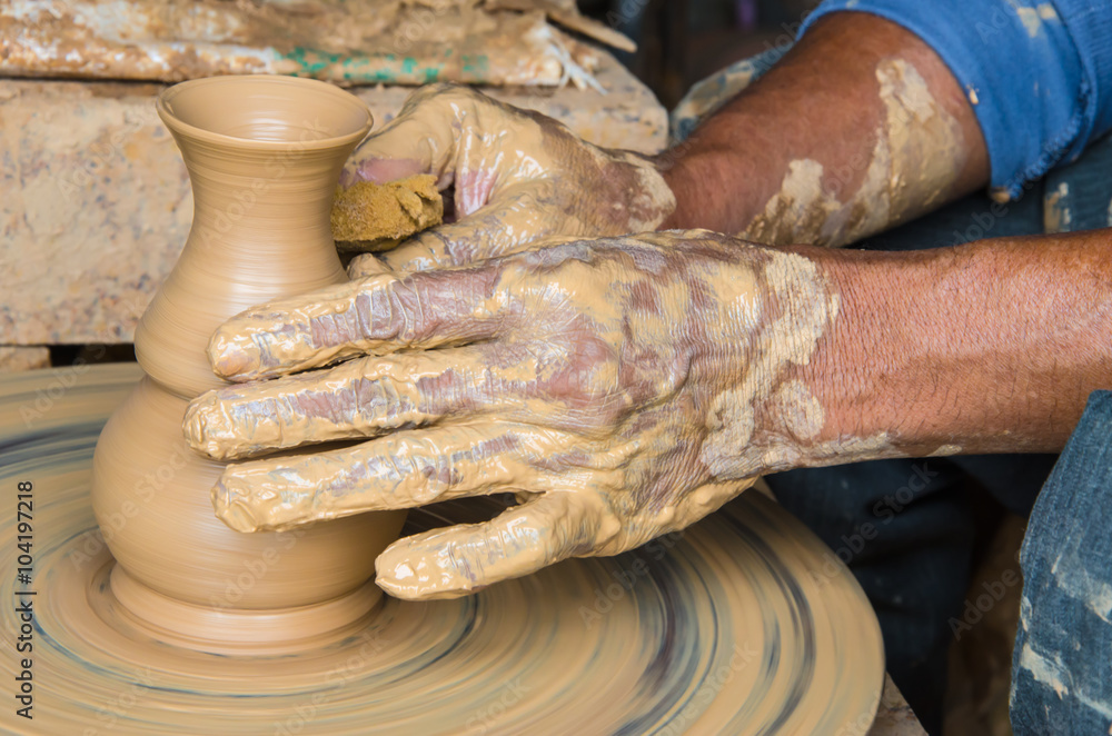Hands of making clay pot on the pottery wheel ,select focus, close-up. Hands of making clay pot on the pottery wheel ,select focus, close-up.