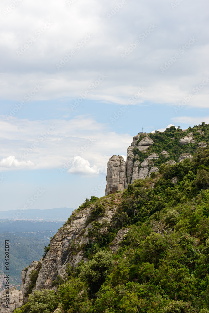 Cliff with Cross of St. Miquel near Montserrat Abbey, Spain.