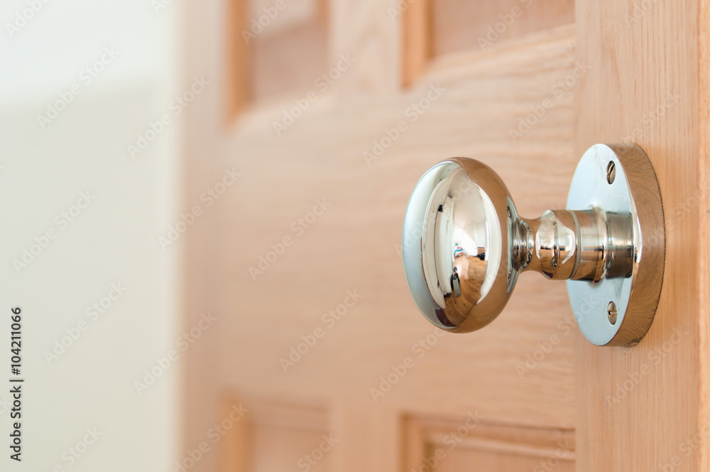Modern door handle on an oak door Modern door handle on an oak door