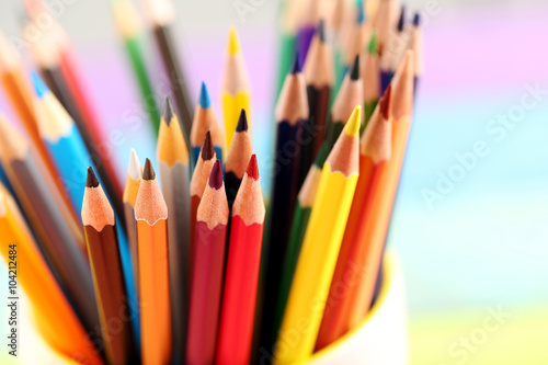 Drawing colourful pencils on a wooden background