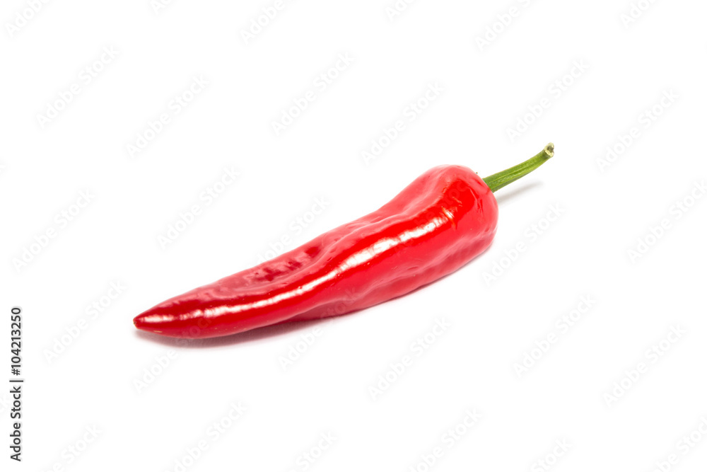 Red Pepper on a white background ready to slice and cooking.