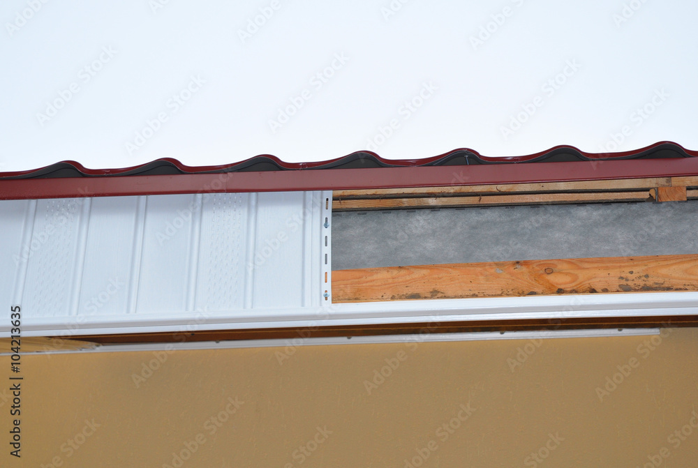 Close up on Soffit and Fascia Installation. New House Roofing Construction. Close up on Soffit and Fascia Installation. New House Roofing Construction.