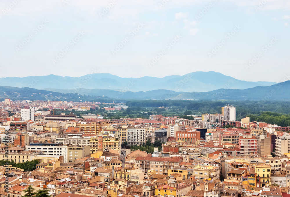 Picturesque city of Girona surrounded by mountains