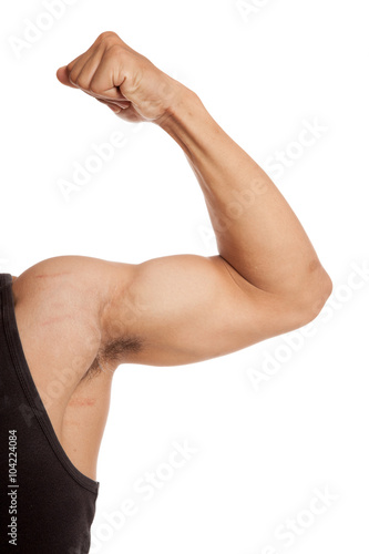 Close up Muscular Asian man arm flexing biceps