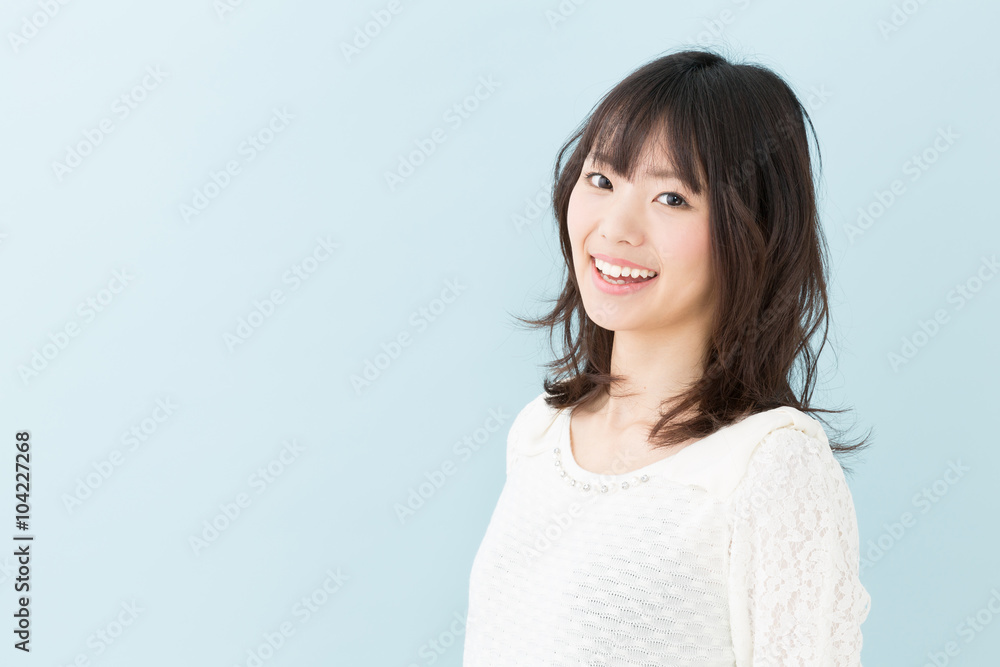 attractive asian woman on blue background attractive asian woman on blue background