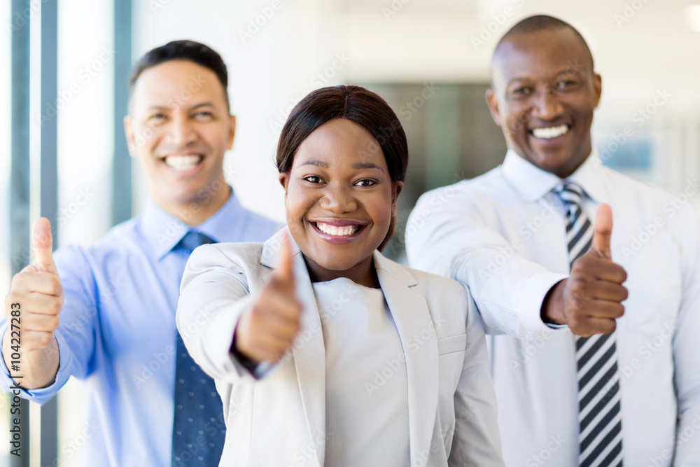 group of businesspeople giving thumbs up
