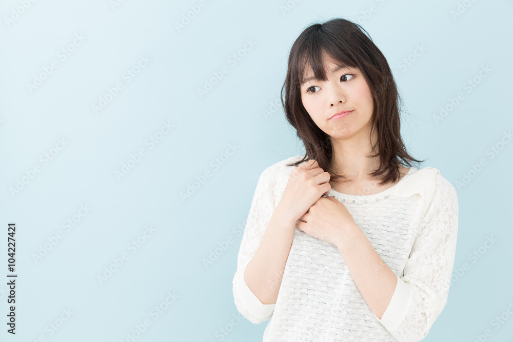 attractive asian woman on blue background attractive asian woman on blue background