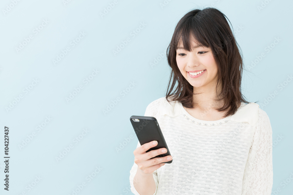 attractive asian woman on blue background attractive asian woman on blue background