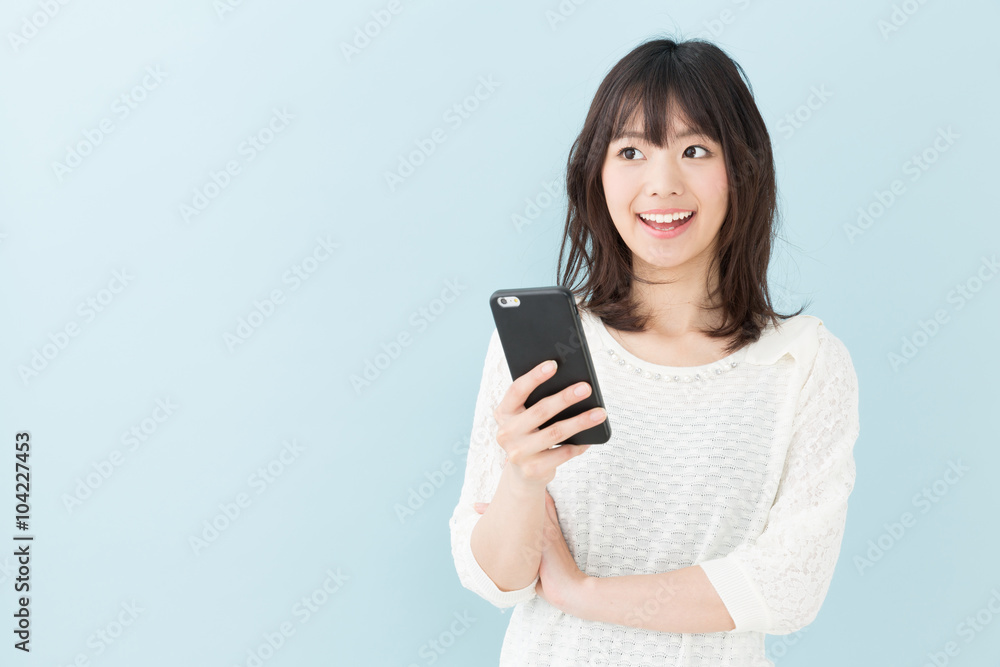 attractive asian woman on blue background attractive asian woman on blue background