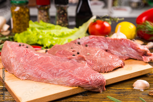 Pieces of meat on cutting board