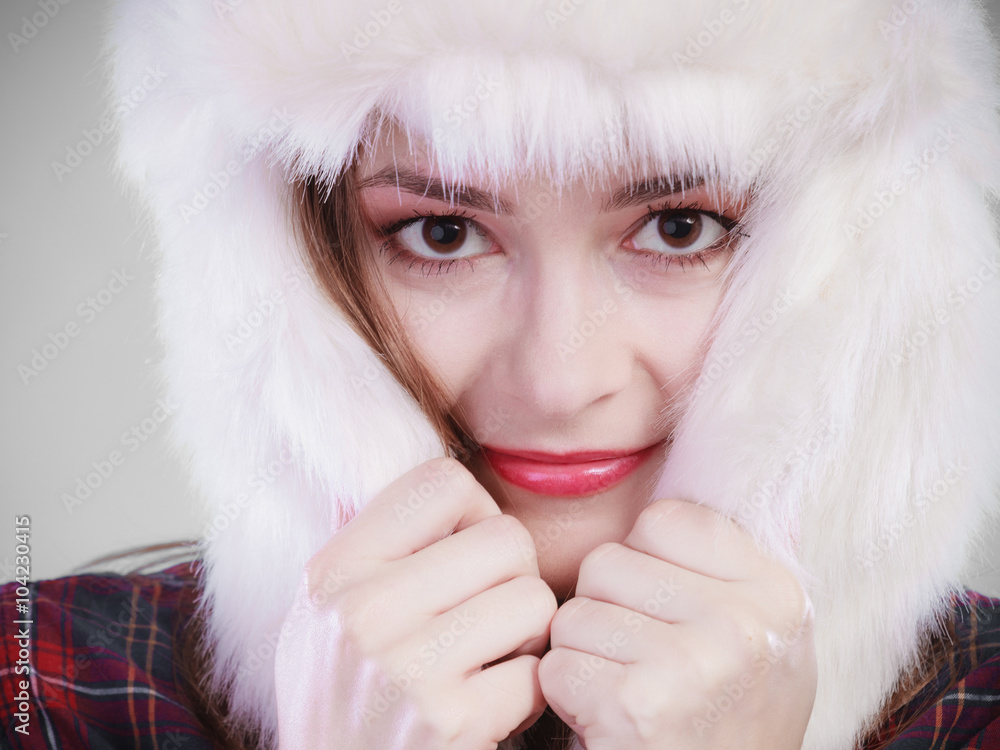 Young woman in winter clothing fur cap Young woman in winter clothing fur cap
