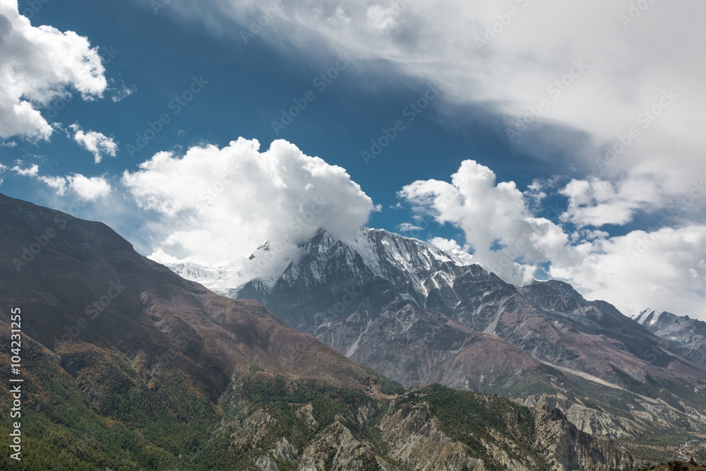 Cloudy sky above Annapurnas in Nepal.