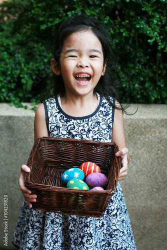 Happy Girl with colorful Easter eggs