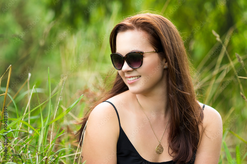 Beautiful Smiling Woman in Grass